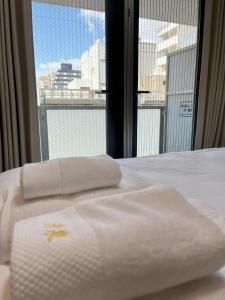 Letto o letti in una camera di 岛之内Leopard心斎橋602 步行5分钟心斋桥商业区