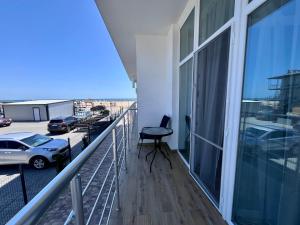 a balcony with a view of a parking lot at Milos Hotel in Zatoka +94 photos