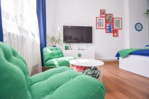 TV a/nebo společenská místnost v ubytování Apartmány v centru Olomouce