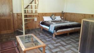 Postel nebo postele na pokoji v ubytování Eaglet Guest House Jibhi