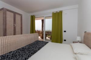 Postel nebo postele na pokoji v ubytování Villa ao Mar