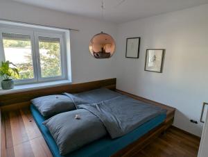 Postel nebo postele na pokoji v ubytování Im Grünen in Puchenau