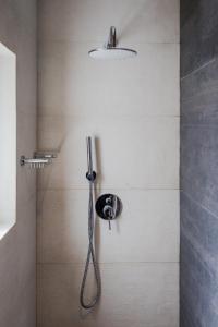 a shower with a shower head in a bathroom at Villa Athina Corfu - 4 bedrooms in Kynopiástai