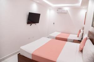 Postel nebo postele na pokoji v ubytování Cataleya Hotel