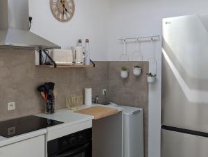 a small kitchen with a sink and a dishwasher at Maison 86 Les Océanes in Damgan