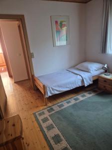 Ein Bett oder Betten in einem Zimmer der Unterkunft Singer-Hof
