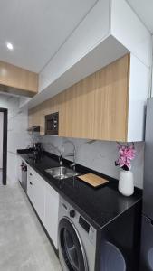 Una cocina o cocineta en Charmant appart en face du stade