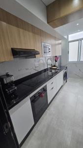 Una cocina o cocineta en Charmant appart en face du stade 8 fotos más