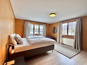 Postel nebo postele na pokoji v ubytování Chalet Gemsblick