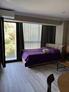 Ένα ή περισσότερα κρεβάτια σε δωμάτιο στο sunny spot +2 φωτογραφίες