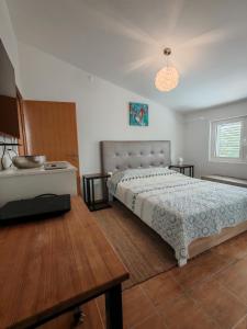 a bedroom with a bed and a table at Rosemary Resort in Cesarica +49 photos