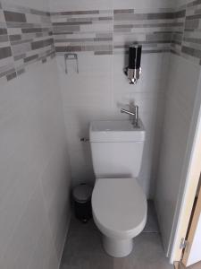 a bathroom with a white toilet in a stall at La Loge de Fleur in Anglars-Saint-Félix +4 photos