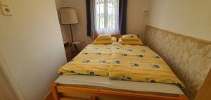 Ένα ή περισσότερα κρεβάτια σε δωμάτιο στο Apartment Zalakaros 3 +24 φωτογραφίες