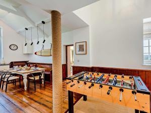 a dining room with a large pool table at 3 Bed in Braunton 53109 in Braunton