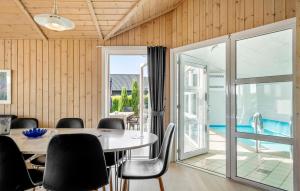 a dining room with a table and chairs at Pet Friendly Home In Hejls With Sauna - F04167 in Hejls