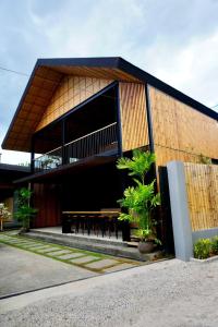 a building with a table in front of it at Mayfair Garden Resort in Panglao
