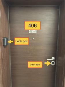 a door with evacuation signs on it with arrows at COSMO 2, 2 Rooms, 2 Beds, 1 Parking, Shopping & Swimming in Voluntari