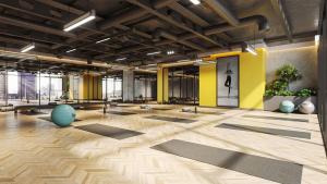 a large room with yoga mats on the floor at Modern Studio In Jlt Cluster L Top Facilities in Dubai