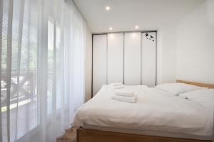 Postel nebo postele na pokoji v ubytování Vila Zea apartments