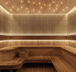 a sauna with a wooden bench with lights on it at Modern Studio In Jlt Cluster L Top Facilities in Dubai