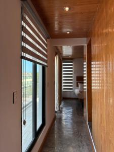 a hallway with a large window in a house at Live the Beach Life Luxury, Location and Total Comfort in Playa del Carmen