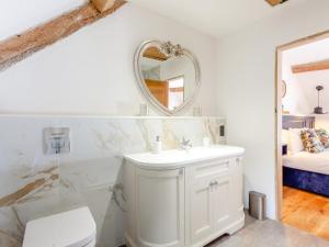 a bathroom with a white sink and a mirror at 1 Bed in Montacute 93149 in Montacute +14 photos