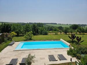 an image of a swimming pool in a yard at La Bohème in Condom