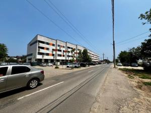 a silver car parked on the side of a street at Ilie Petre Luxury Suites in Chiajna