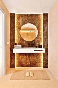 a bathroom with a mirror and a sink at SariStays Valencia City Center L in Valencia