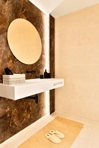 a bathroom with a sink and a mirror at SariStays Valencia City Center L in Valencia