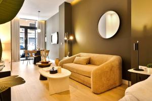 a living room with a couch and a mirror at SariStays Valencia City Center L in Valencia +10 photos