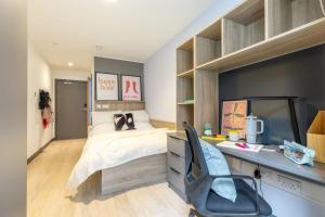 a bedroom with a bed and a desk with a computer at Curraheen Point Cork - Easy Access to City Centre in Cork +81 photos