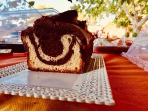 a piece of cake on a plate on a table at Da Mesciu Nzinu in Sannicola