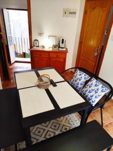a table with a basket on it in a room at Casita de Pescadores en La Costera in Villajoyosa