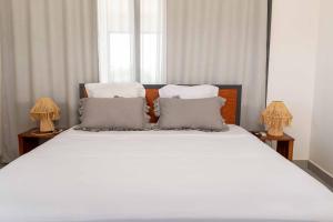Postel nebo postele na pokoji v ubytování Hotel Naka
