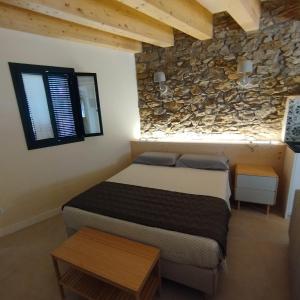 Ένα ή περισσότερα κρεβάτια σε δωμάτιο στο Empordà Apartament-Peratallada