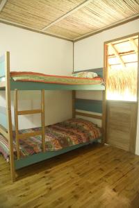 a bedroom with two bunk beds in a room at City Escape Casa Mariguana in Turbaco