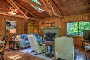 a living room with a fireplace and a tv at Hoot on the Hill By Carolina Mornings in Weaverville