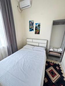 Postel nebo postele na pokoji v ubytování Happy House Hotel