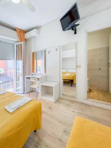 Postel nebo postele na pokoji v ubytování Hotel Miramare