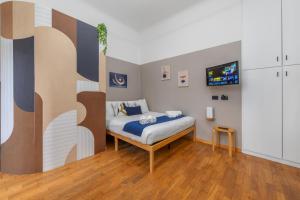 Ένα ή περισσότερα κρεβάτια σε δωμάτιο στο Design Nook - In the heart of the Design District