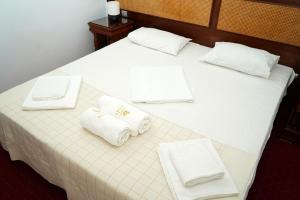 Postel nebo postele na pokoji v ubytování Hotel Bliss