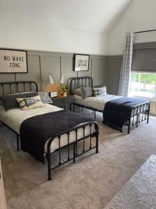 a bedroom with two beds and a no wake zone sign at Bulwer Breeze Guesthouse in Durban