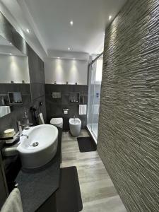 a bathroom with a sink and a toilet and a shower at B&B GarbaCity-Inn in Rome +61 photos