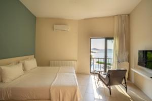 A bed or beds in a room at Med-Inn Hotel