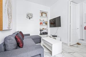 Televízia a/alebo spoločenská miestnosť v ubytovaní Appartement Beau Site - Welkeys