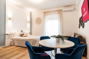 Ένα ή περισσότερα κρεβάτια σε δωμάτιο στο Barirooms - Picca 24