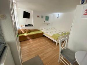 Posteľ alebo postele v izbe v ubytovaní Skenderi Apartment Studio