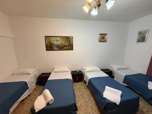 Una cama o camas en una habitación de Host Roma