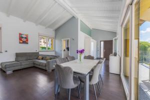 a dining room with a table and chairs and a couch at Lake & Whispers - Among Lake Como and Switzerland in San Fedele Intelvi +33 photos